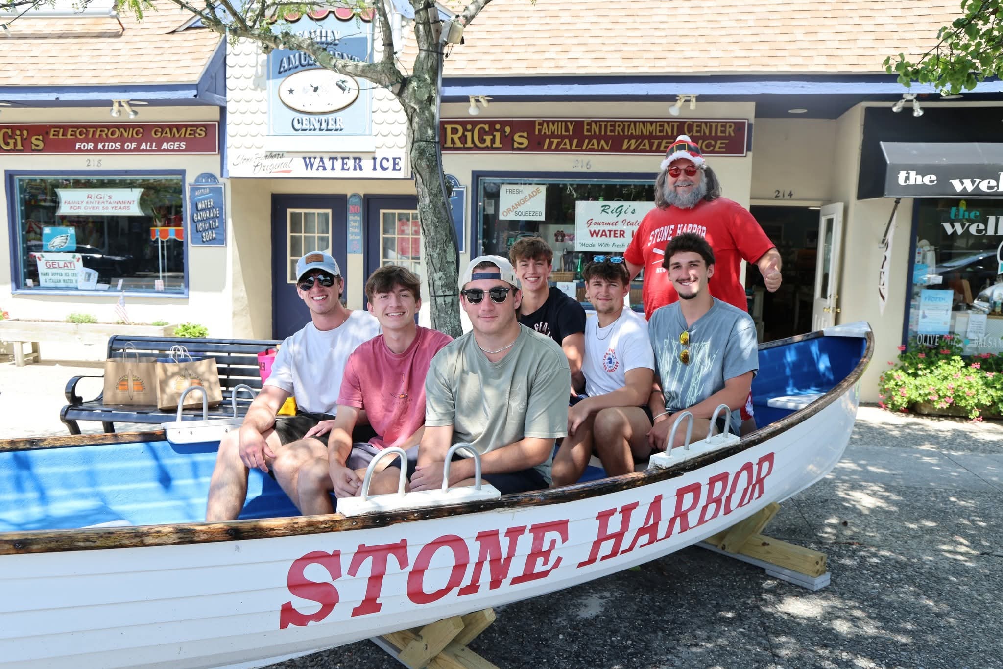 Cape May County Santa with six teenage boys wearing sunglasses in the Stone Harbor boat