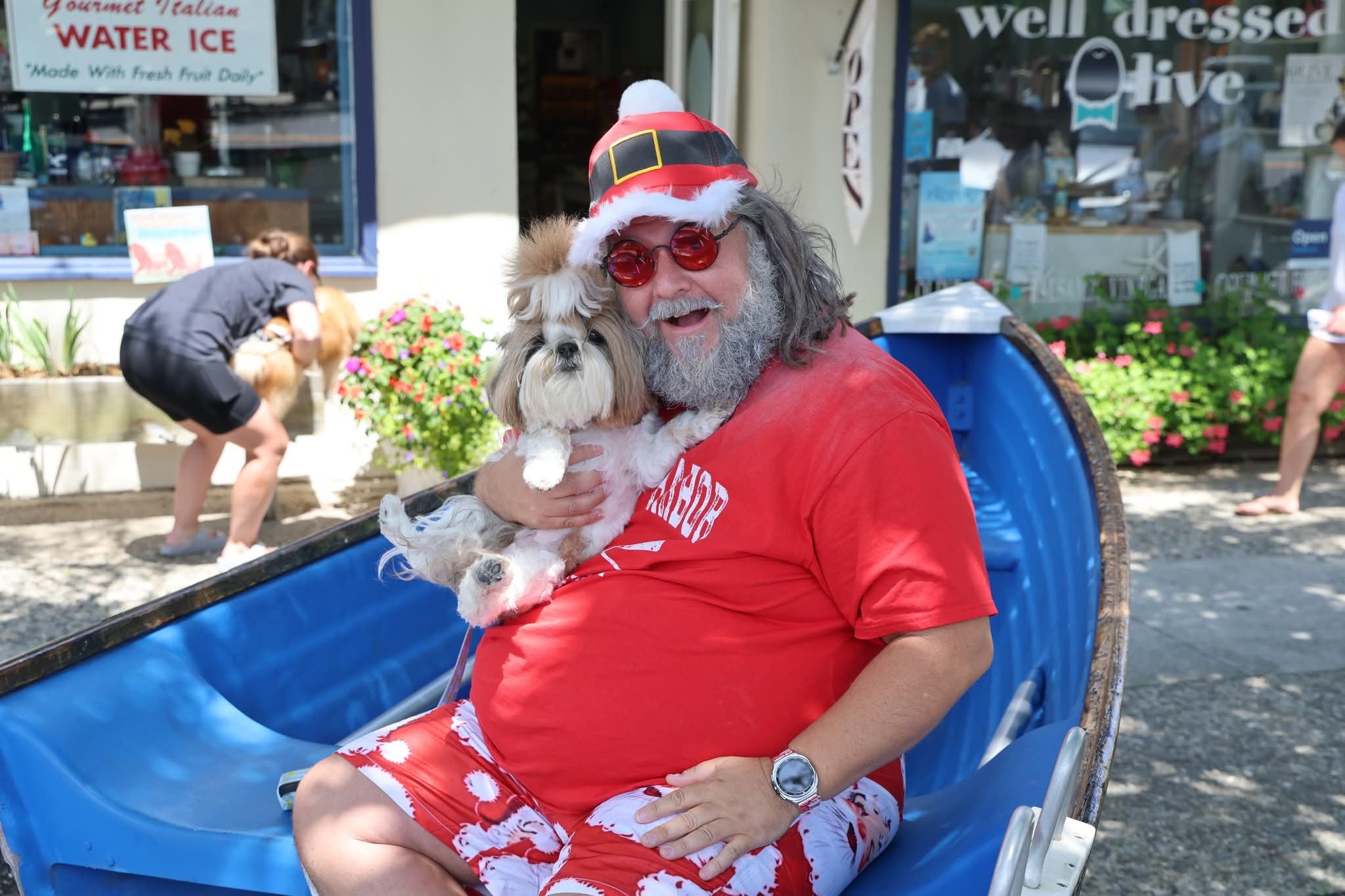 Cape May County Santa holding a Shih Tzu dog in the Stone Harbor boat