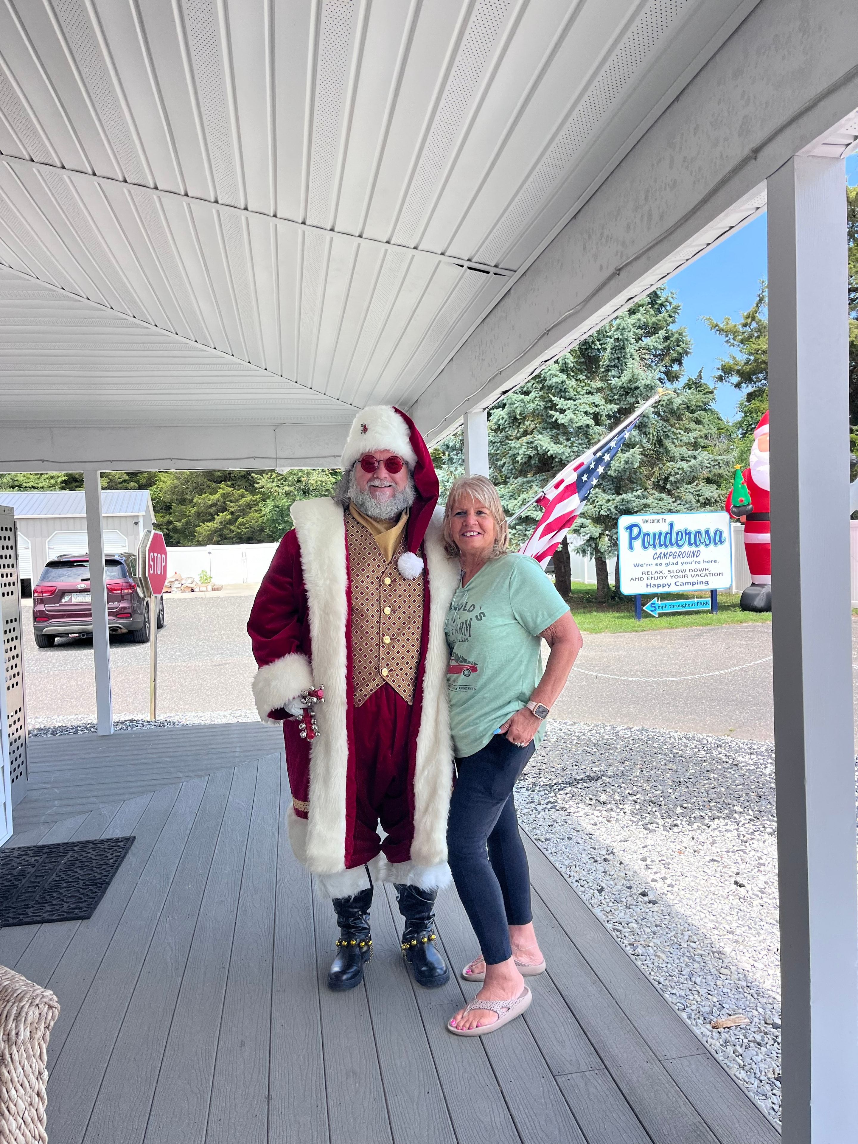 Cape May County Santa posing with a woman at Ponderosa Campground entrance