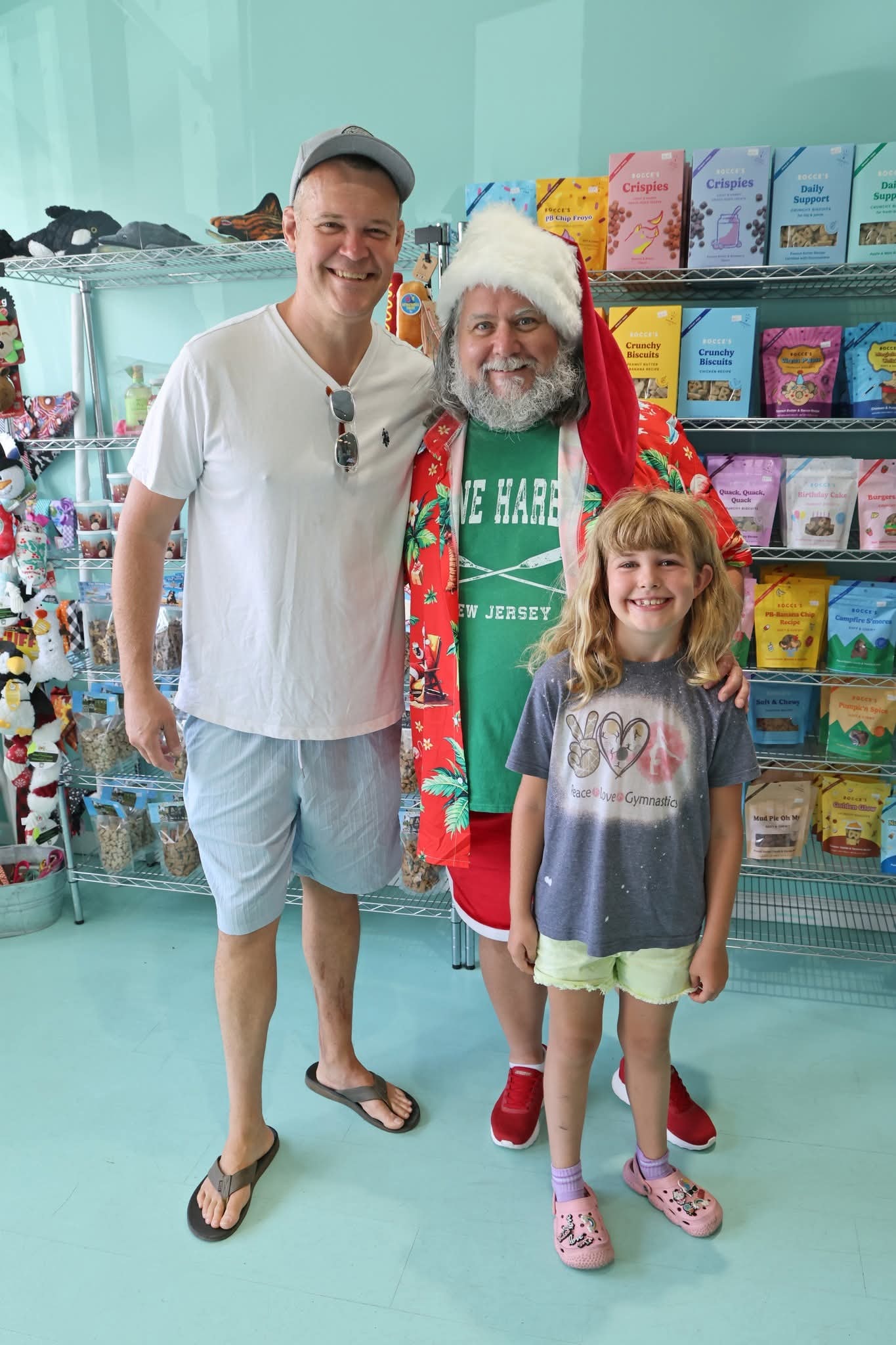 Cape May County Santa holding a dog at a pet store