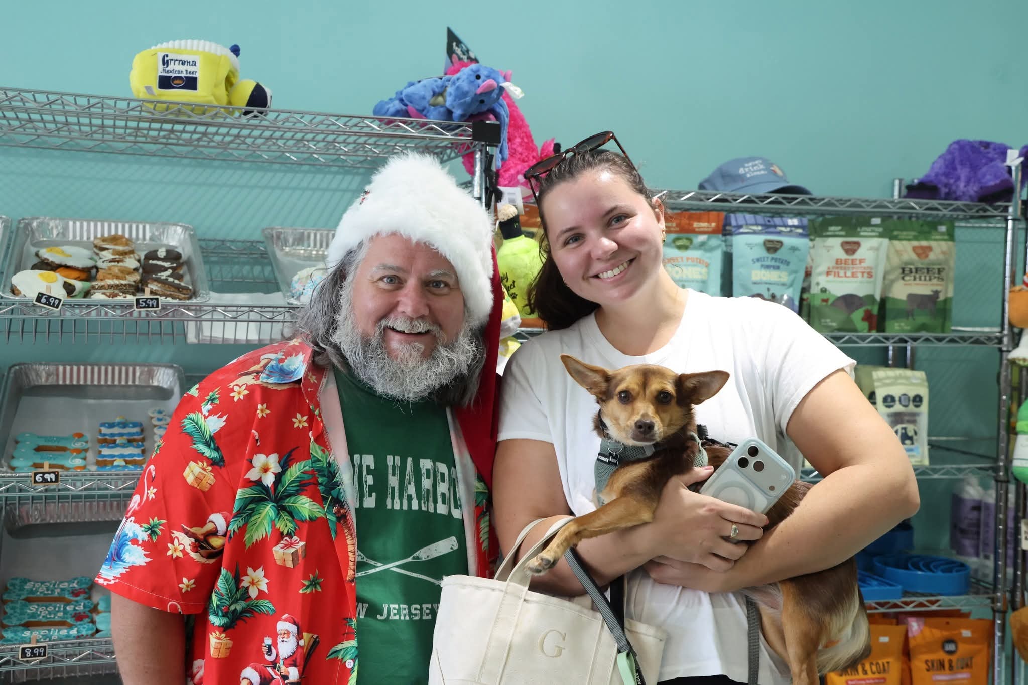 Cape May County Santa with a family at a pet store