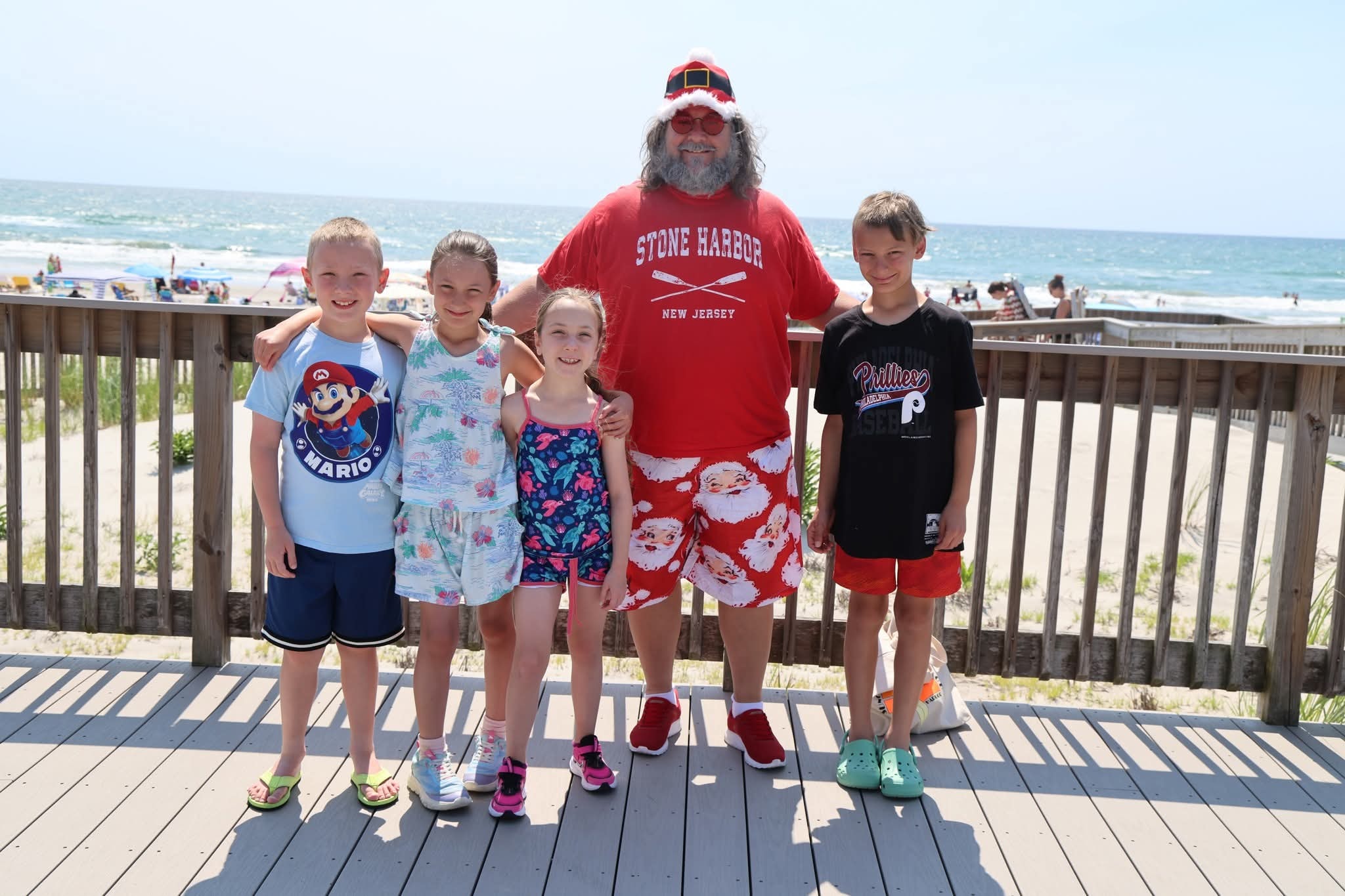 Cape May County Santa with four kids on the boardwalk