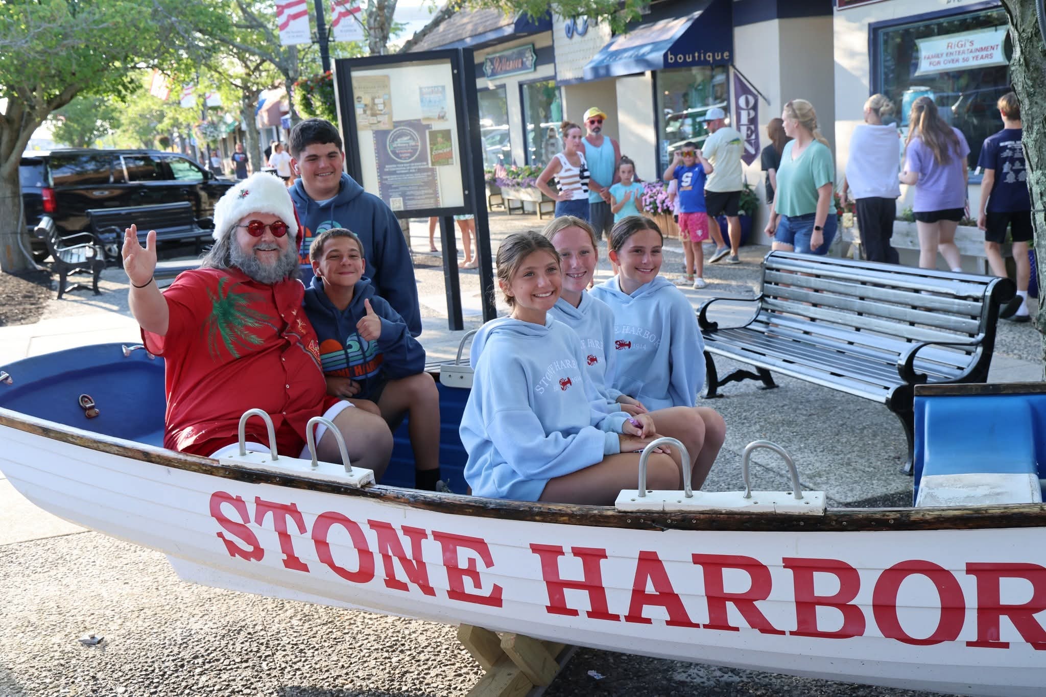 Cape May County Santa with five kids in the Stone Harbor lifeguard boat on the main street