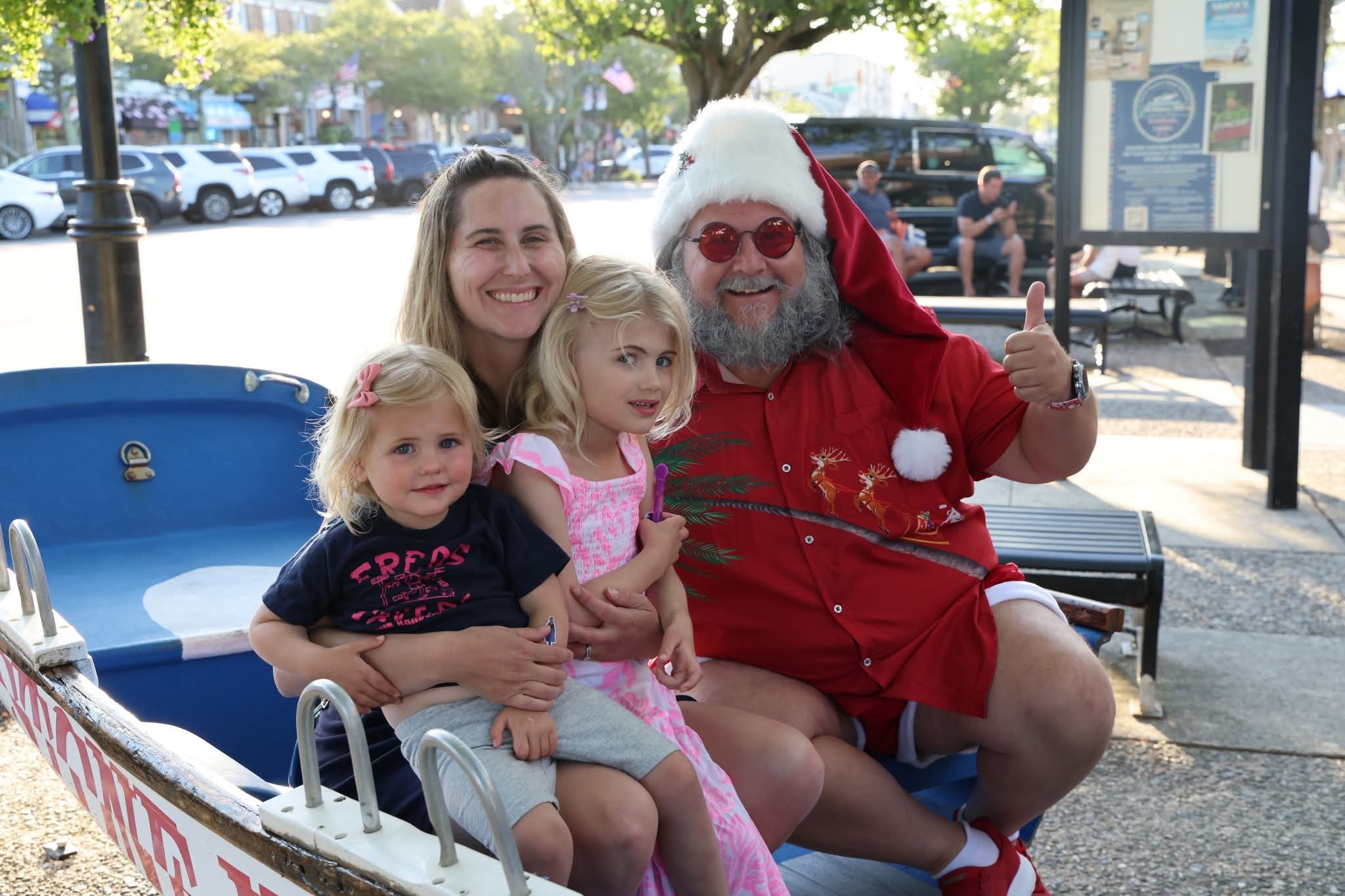 Cape May County Santa with a mom and two toddler girls in the Stone Harbor boat