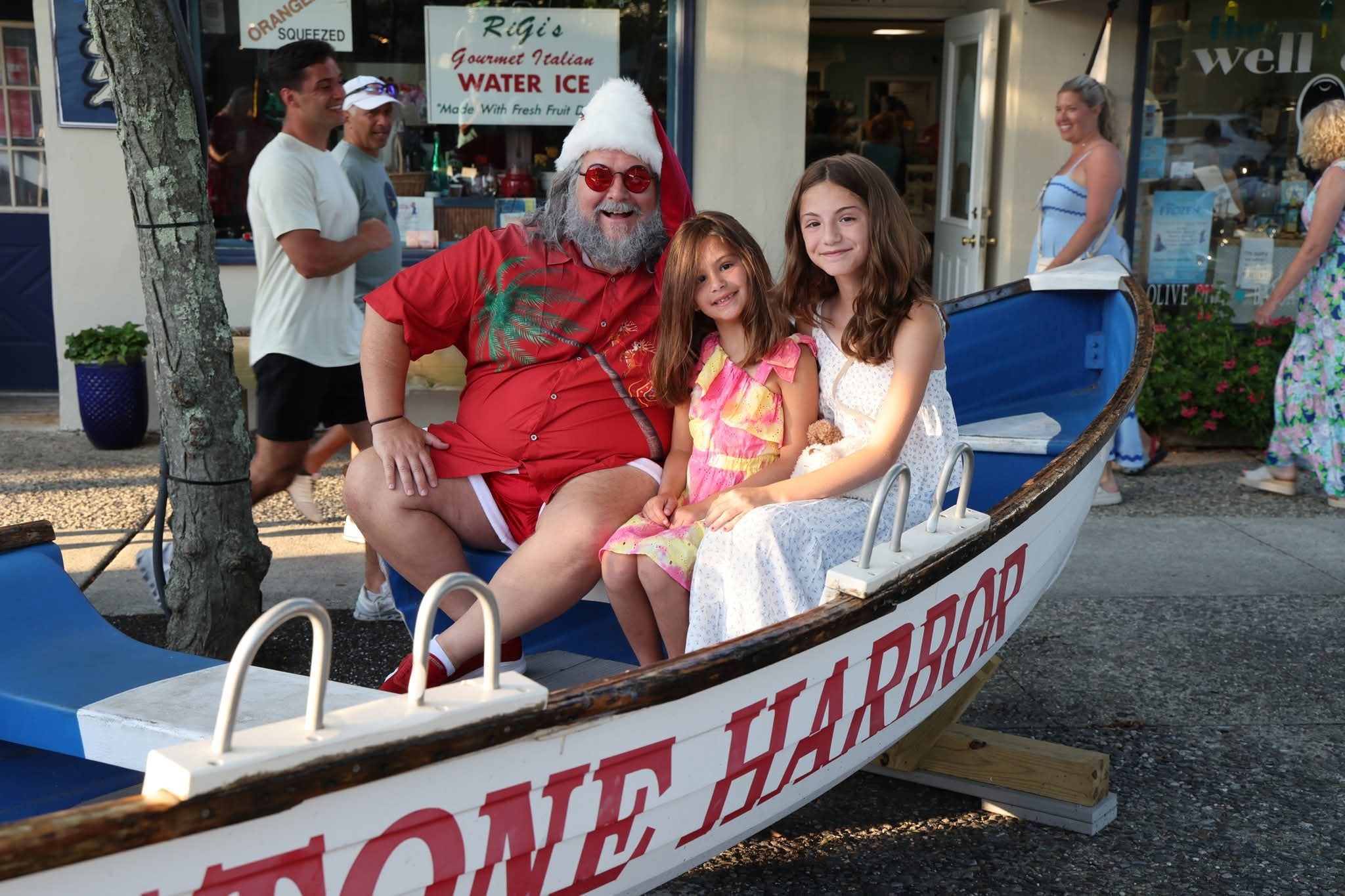 Cape May County Santa with two girls in the Stone Harbor boat at golden hour