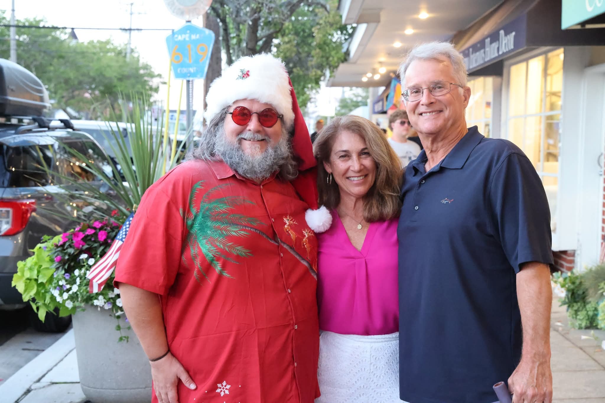 Cape May County Santa with a couple on the street near the Cape May 619 County Route sign