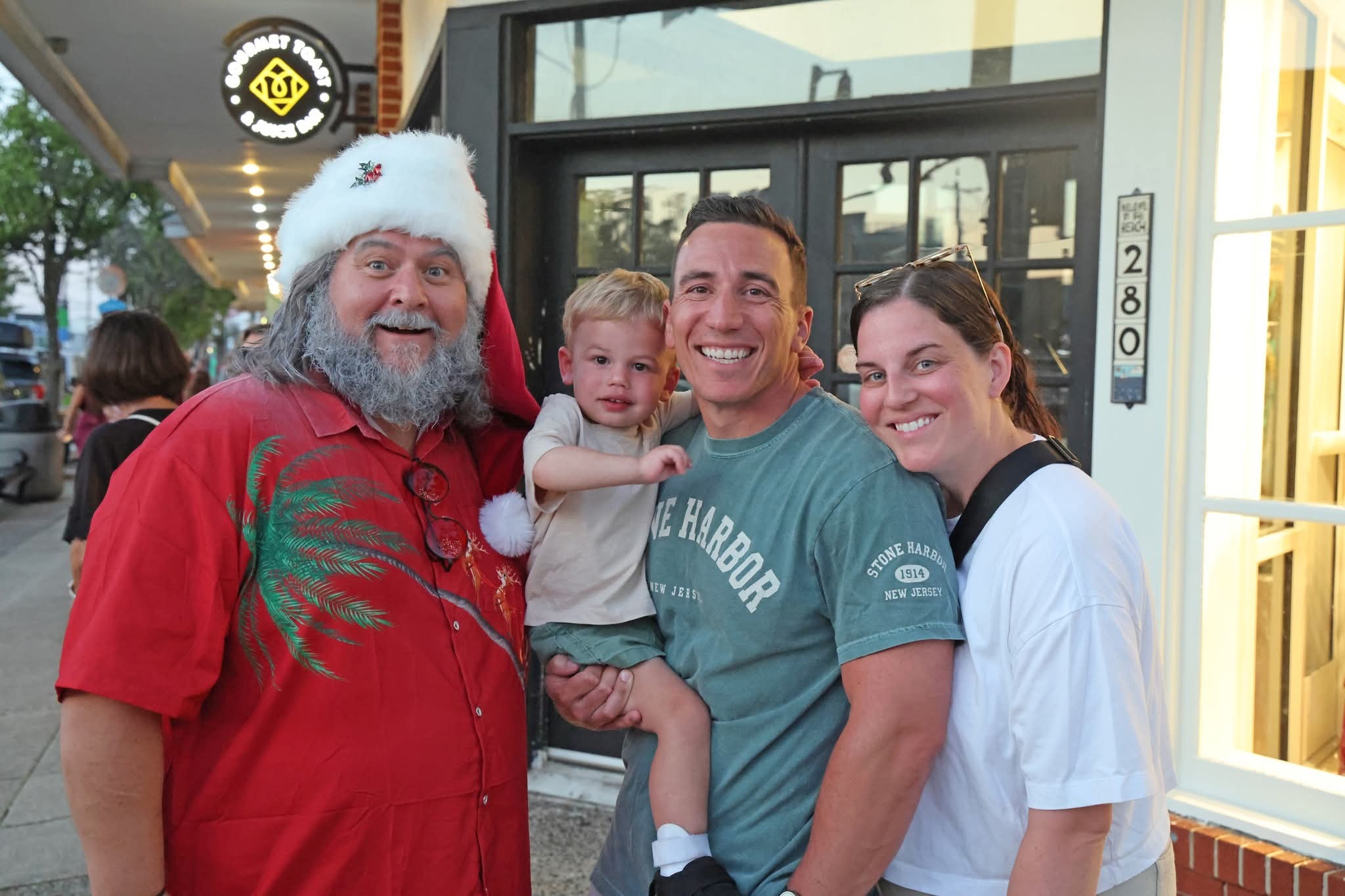 Cape May County Santa with a family of three outside Toastique Gourmet Toast and Juice Bar